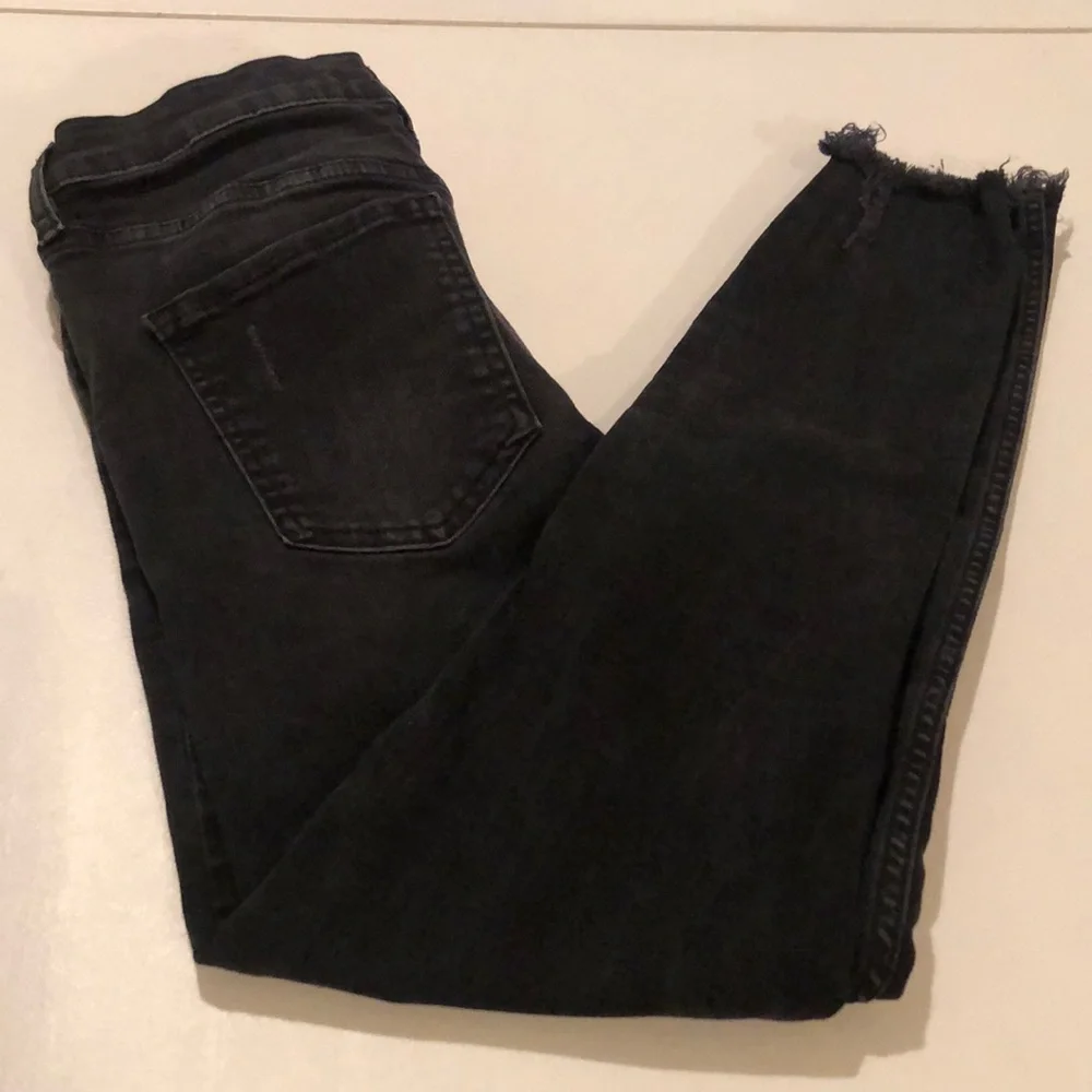 Free People size 27 Black Wash skinny jeans distressed with raw hem